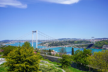 Fototapeta na wymiar Sea transportation, Bosphorus. Rumelihisari, Rumelian Castle, Roumeli Hissar Castle, is a medieval fortress, Istanbul, Turkey. View of Fatih Sultan Bridge or Second Bosphorus Bridge.