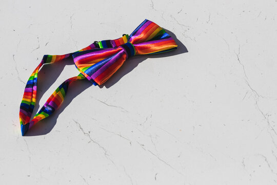 a bow tie with lgbt colors. copy space