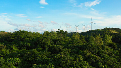 Fototapeta na wymiar Wind turbines in the mountains. Wind mills for electric power production in the Philippines, Luzon.