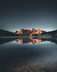 Lake Misurina in the Dolomites Mountains during Morning with glowing Peaks and Reflection in the Water