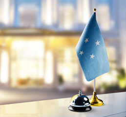 Federated States Micronesia flag on the reception desk in the lobby of the hotel