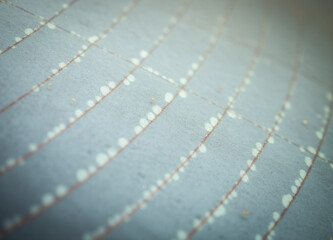 Water droplets on the surface of the car rear window in close-up view with vignette effect, selective soft focus.