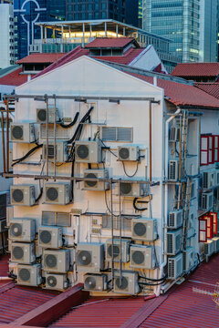 Full Of Air Conditioning Outdoor Units Hanging On The Wall At The Backstreet In Singapore At Night