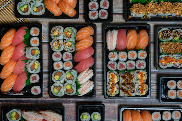 The concept of Japanese food. The restoration, the different types of sushi on a plate or on a tray.