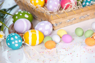 Hand painted pastel colored Easter eggs background. Happy Easter greeting card or invitation.