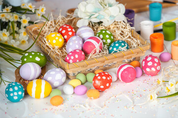 Hand painted pastel colored Easter eggs background. Happy Easter greeting card or invitation.