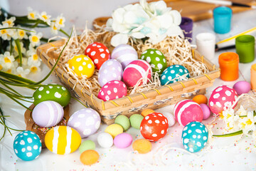 Hand painted pastel colored Easter eggs background. Happy Easter greeting card or invitation.