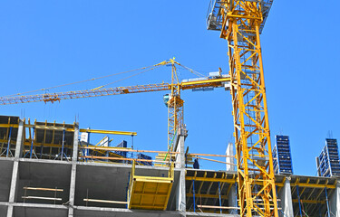 Crane and highrise construction site