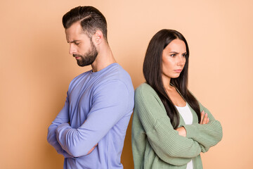 Back-to-back photo of young unhappy upset sad couple wife and husband in argument quarrel isolated...