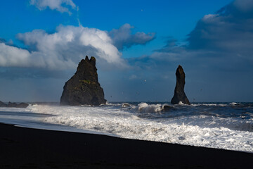 The cliffs by the township of Vik in Iceland Reynisdrangar basalt sea stacks