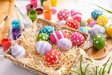 Hand painted pastel colored Easter eggs background. Happy Easter greeting card or invitation.