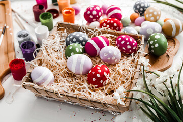 Hand painted pastel colored Easter eggs background. Happy Easter greeting card or invitation.