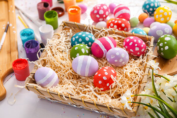 Hand painted pastel colored Easter eggs background. Happy Easter greeting card or invitation.