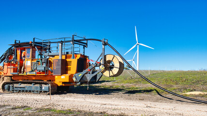 Cable laying within a wind farm