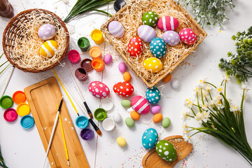 Hand painted pastel colored Easter eggs background. Happy Easter greeting card or invitation.