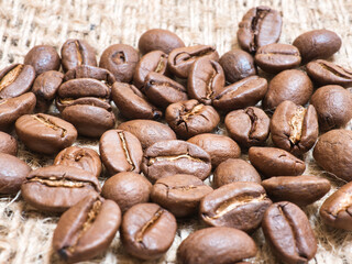 roasted coffee beans of the Arabica coffee variety. Focus on image center