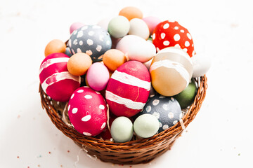 Hand painted pastel colored Easter eggs background. Happy Easter greeting card or invitation.