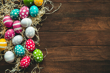 Hand painted pastel colored Easter eggs background. Happy Easter greeting card or invitation.