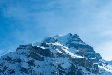 Fototapeta na wymiar View from Muerren, a village in Switzerland, to the mountains Eiger and Moench