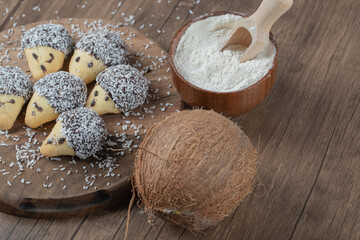 Oak cone shape chocolate cookies on a wooden board