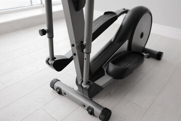 Modern elliptical machine cross trainer on floor indoors