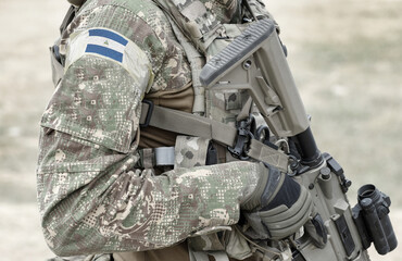 Soldier with assault rifle and flag of Nicaragua on military uniform. Collage.