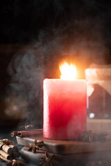 mystical still life with burning candles and fog