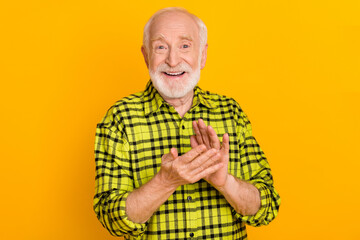 Photo of cheerful man happy positive smile applause congrats pensioner grandfather isolated over yellow color background