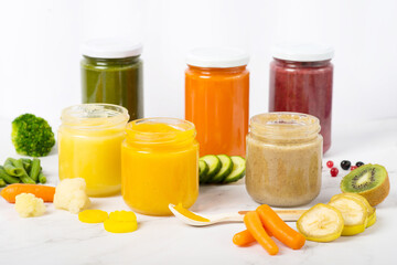 Variety of homemade baby vegetable and fruit puree