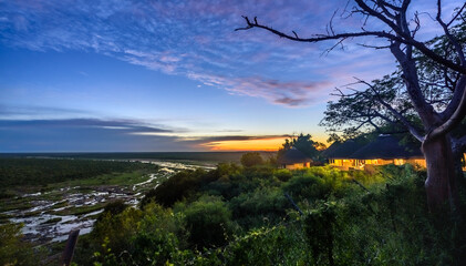 A colourful dusk over the Olifants river and a restcamp in Kruger NP, South Africa.