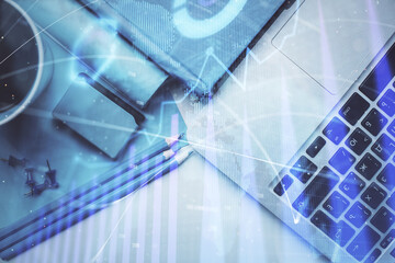 Double exposure of forex graph drawing over desktop background with computer. Concept of financial analysis. Top view.