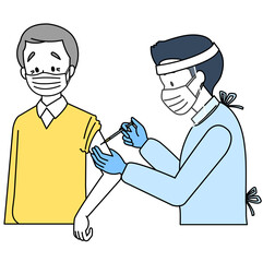 予防接種を受ける高齢男性（マスクとフェイスシールド）