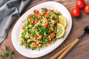 Tabbouleh or Tabouleh salad with bulgur, eastern appetizer 