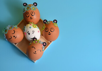 Easter eggs in a box on a blue background. Easter.