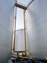 Fuel storage tank oil. Large white industrial for tank oil. Crude oil export factory industry And...