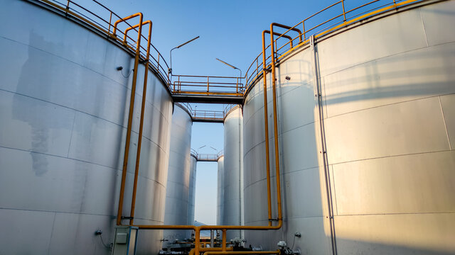 Fuel storage tank oil. Large white industrial for tank oil. Crude oil export factory industry And storage tank . industrial pipes 
