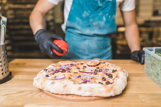 Making focaccia with olives and union
