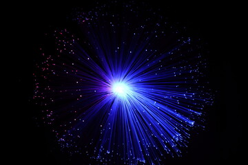 Big bang effect background. Flying lights blue, red, purple. Fireworks.