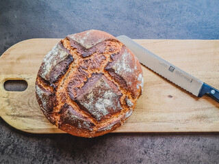 loaf of bread on a wooden board