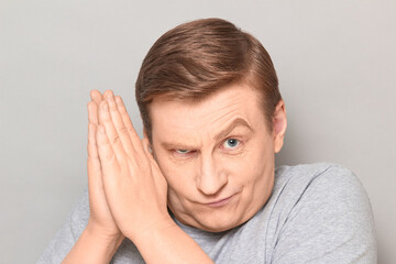 Portrait of mature man conspiring and scheming