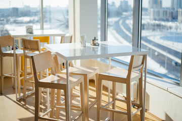 beautiful kitchen in the office with large panoramic windows and city views