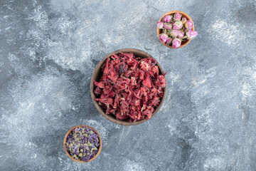 Variety of dried flowers in wooden bowls