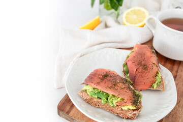 Salmon toast with avocado and dill. Perfect protein breakfast. Food photography