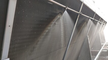 Cooling system for industrial heat exchangers. Industrial fan cooling tower.  Cooling Tower of Power Plant. Cooling tower adiabatic cooling system. Metal industrial air cooling system vent. 