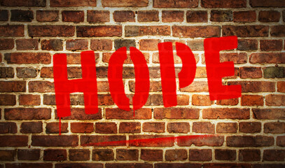 Fototapeta na wymiar Hope spray painted inscription on the brick wall