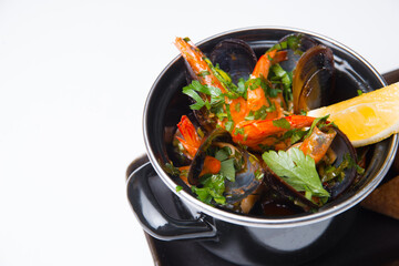 Photo of tasty delicious fresh mussels boiled in a pan, sea food.