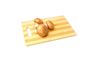royal champignons on cutting board isolated on white