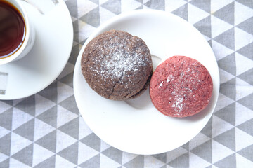 close up of red velvet cookies on wooden table 