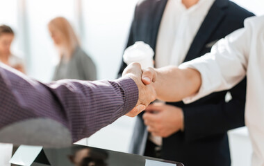 close up. young business people greeting each other with a handshake.