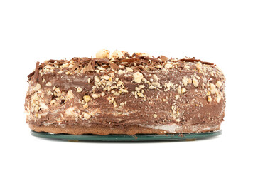 Sponge cake sprinkled with chocolate chips and hazelnuts.